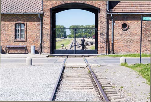 Photograph of Birkenau entrance gate in May 2017.